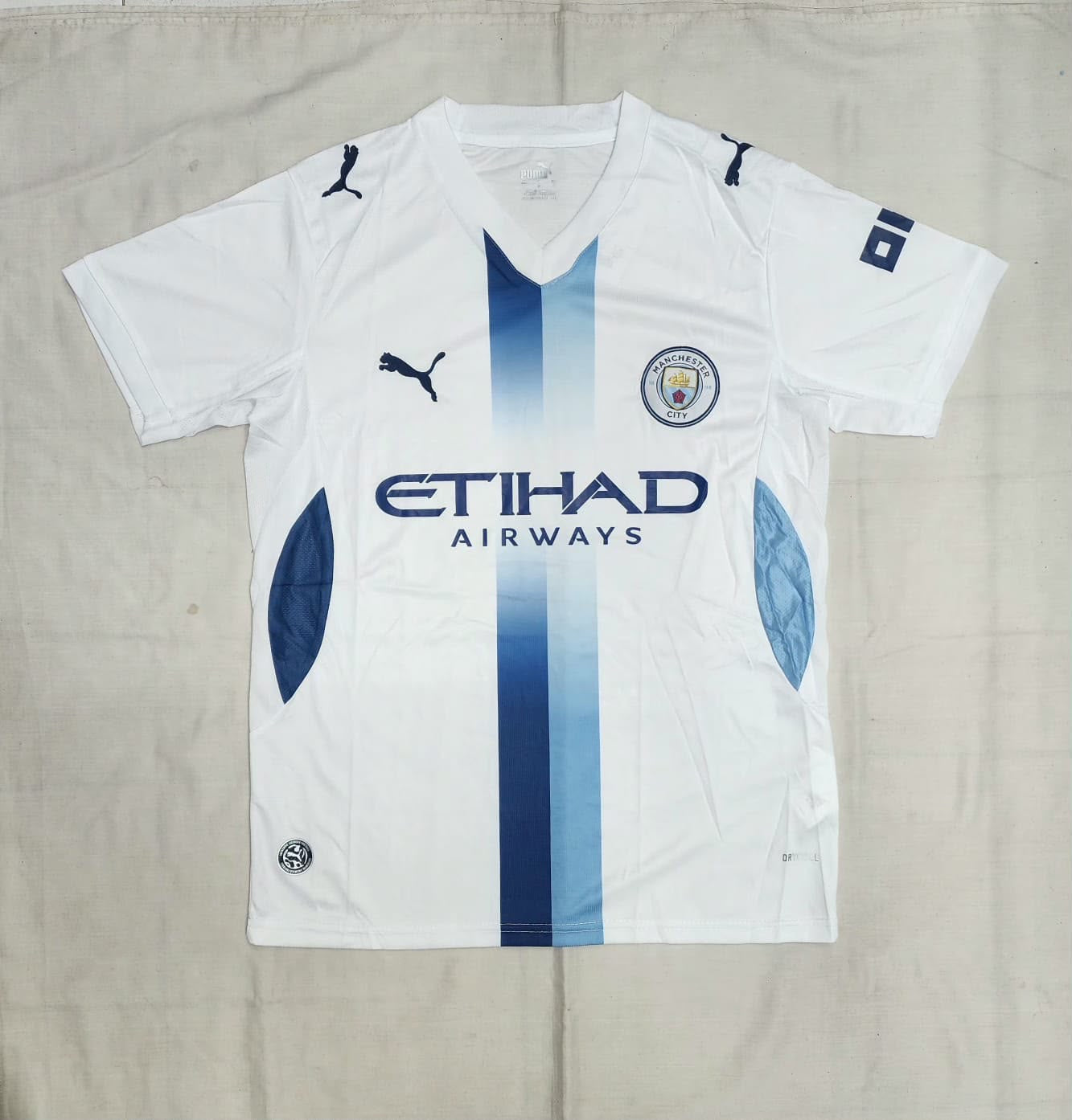 Manchester City FC Puma Away Jersey – White | Navy Stripe & Petal Panels | Etihad Airways